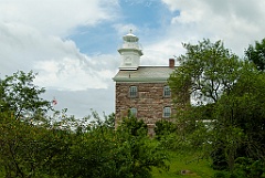 Great Captain Island Lighthouse Among Trees on Hilltop
